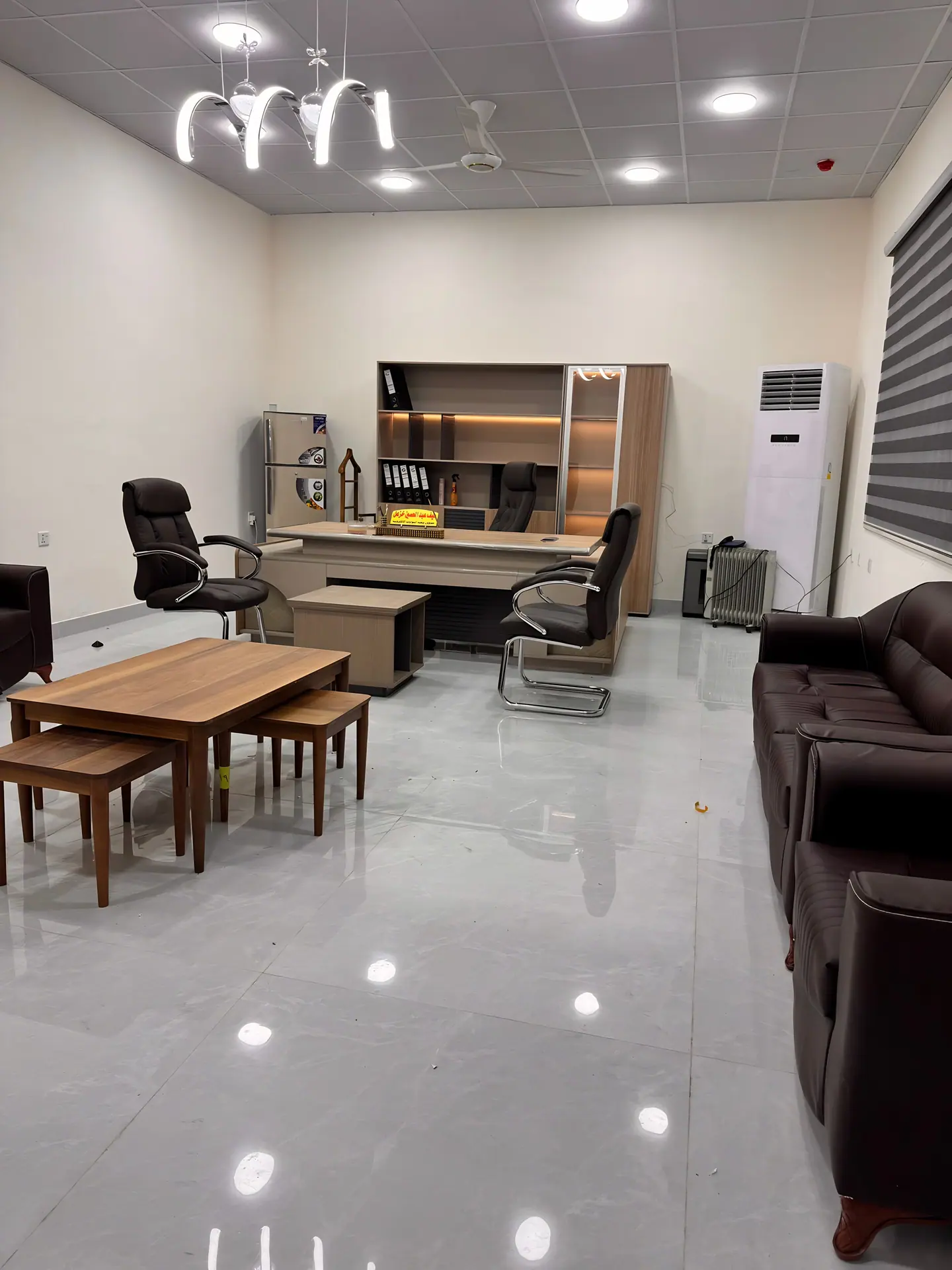 Furnished office with desk and seating