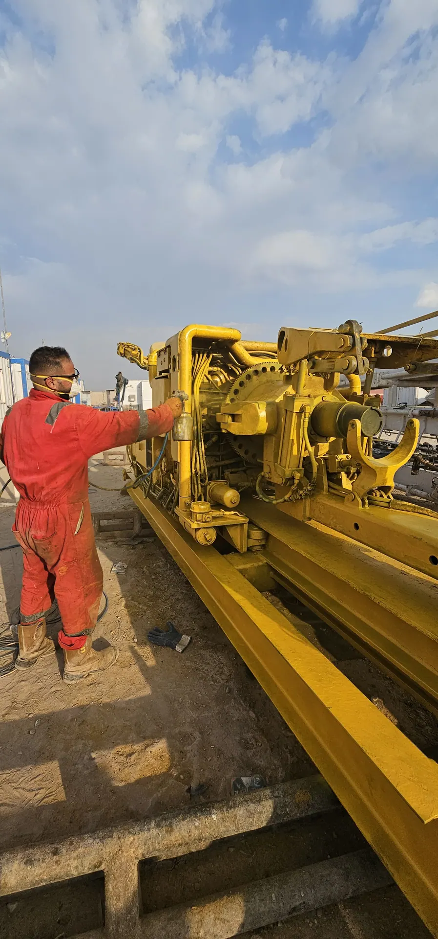Technician operating rig floor equipment